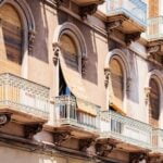 Italian Travel Poster Colorful Italian travel poster featuring iconic landmarks, such as the Colosseum and the Leaning Tower of Pisa