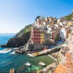 Family enjoying the beautiful sights of Italy while traveling with their two-year-old