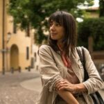 Illustration of American travelers enjoying the scenic beauty and cultural attractions of Italy