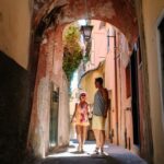 Excited children exploring Italy's beautiful sights and landmarks during a family vacation