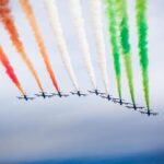 Italian air travel: A plane flying over the beautiful landscapes of Italy