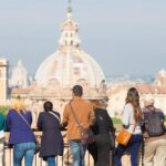 Tourists in a group exploring Italy's attractions independently, enjoying their trip in January